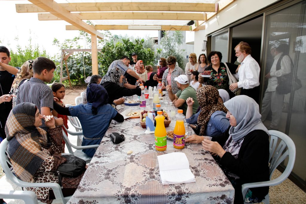 Thirsty travelers are welcomed to Faradis. A bus of 55 Palestinians and Israelis from Jerusalem arrived at the 'Tent of Sarah and Hagar'.