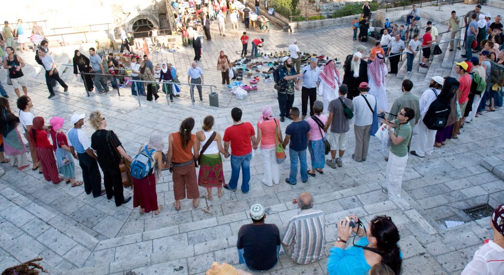 People gather on the steps of Damascus Gate