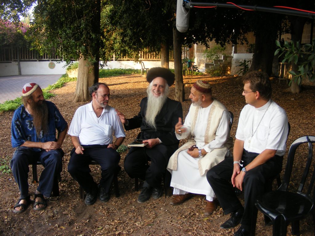 Religions talk peace. From left: Michael Golomb, Rabbi Marc Gopin, Rabbi Menachem Froman, Sheikh Abdul Aziz Bukhari, Rev. Uwe Grabe