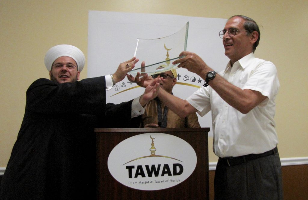 Imam Zaher and Ted hold the award together